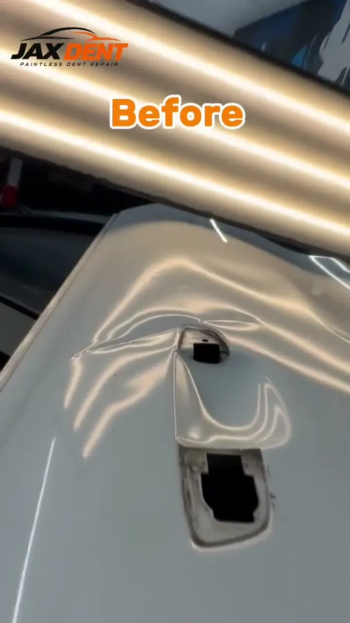 Before-and-after video of a dent repair on the rear panel of a white vehicle.